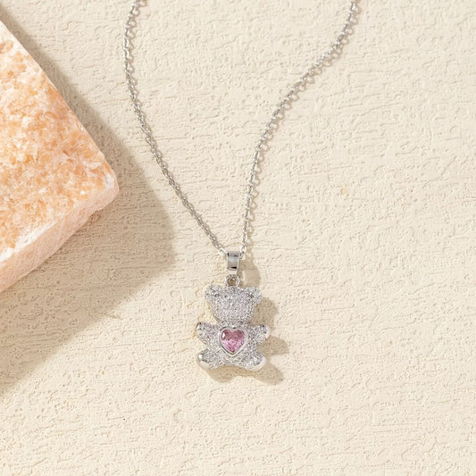 A delicate and adorable pink heart-shaped bear pendant copper necklace, adorned with synthetic zirconia, V1102-XDZXL001