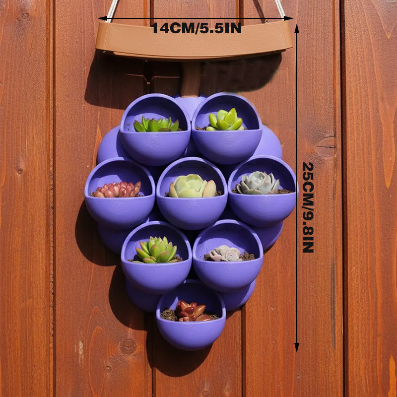3D-printed grape pots in purple, brown, and green. V1195-VYY0067