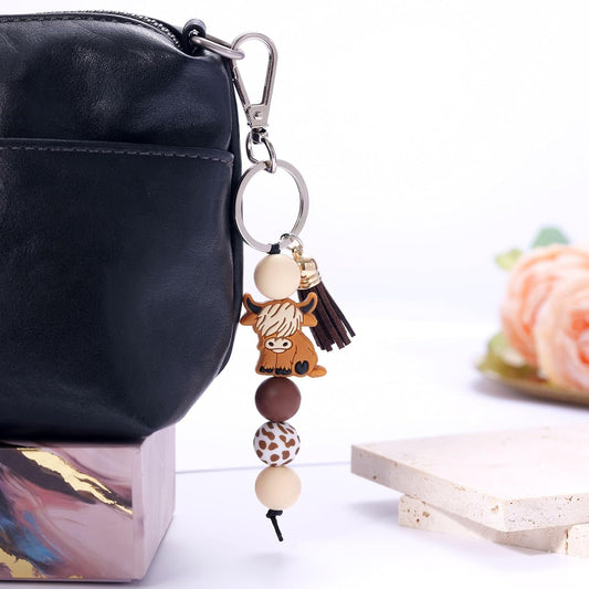 Kvekstio Cute Highland Cow Keychain, 2 Pack Farm Animal Cow Print Silicone Bead Key Ring with Tassel Gift for V1258-DP02-B-1107