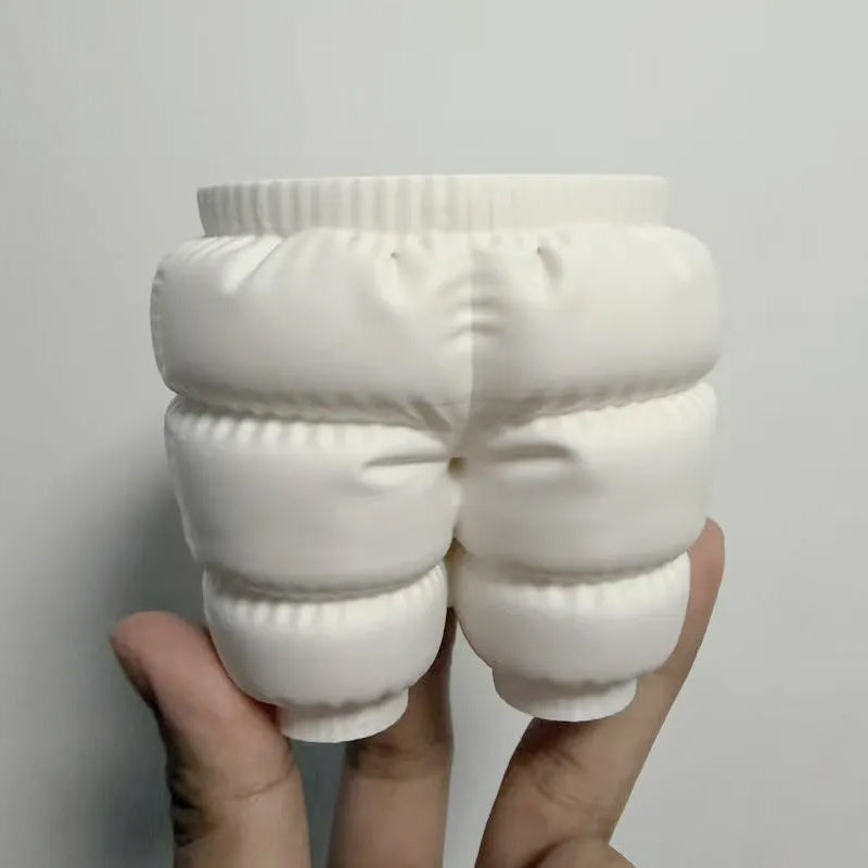 A unique 3D printed down-filled pants pen holder desktop organizer, white. V1195-VYY0034