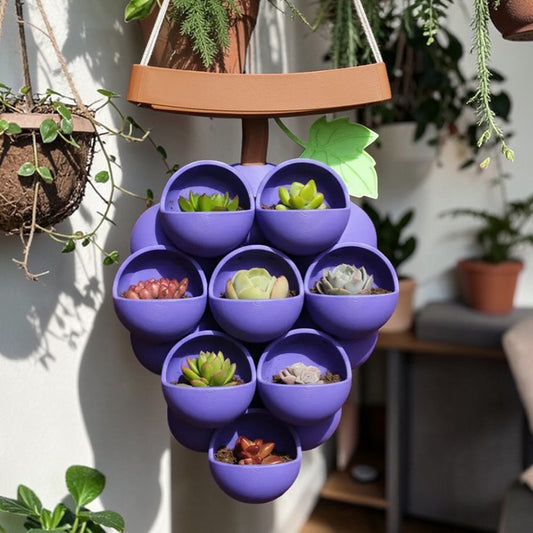 3D-printed grape pots in purple, brown, and green. V1195-VYY0067