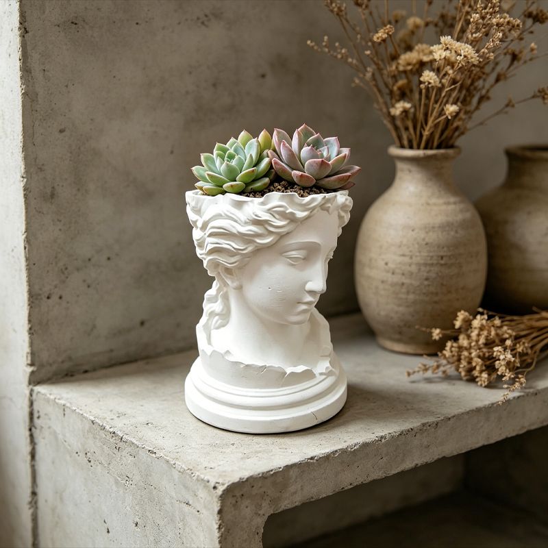 A 3D-printed, broken goddess-themed flowerpot, combining decorative and functional elements, in white. V1195-VYY0093