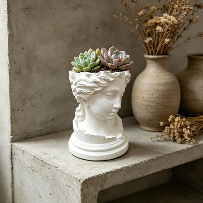 A 3D-printed, broken goddess-themed flowerpot, combining decorative and functional elements, in white. V1195-VYY0093