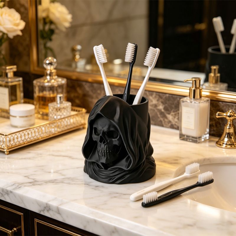 3D-printed hooded skull organizer, perfect for storing toothbrushes and toothpaste in your bathroom. Black. V1195-VYY0095