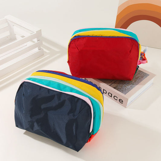 Dopamine Color-Blocking Cosmetic Bag, waterproof with large capacity, layered storage for skincare and makeup, easy opening and closing with drawstring zipper, essential sweet storage item for travel and commuting./(front) black (back) sky blue