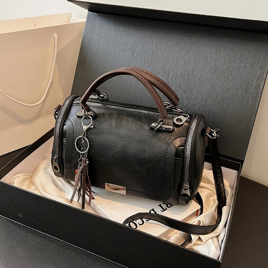 Vintage Tote Bag: Spacious multi-pocket design with tassel and metal accents, supports multiple carrying V1232-FGSTB001