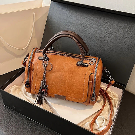 Vintage Tote Bag: Spacious multi-pocket design with tassel and metal accents, supports multiple carrying V1232-FGSTB003