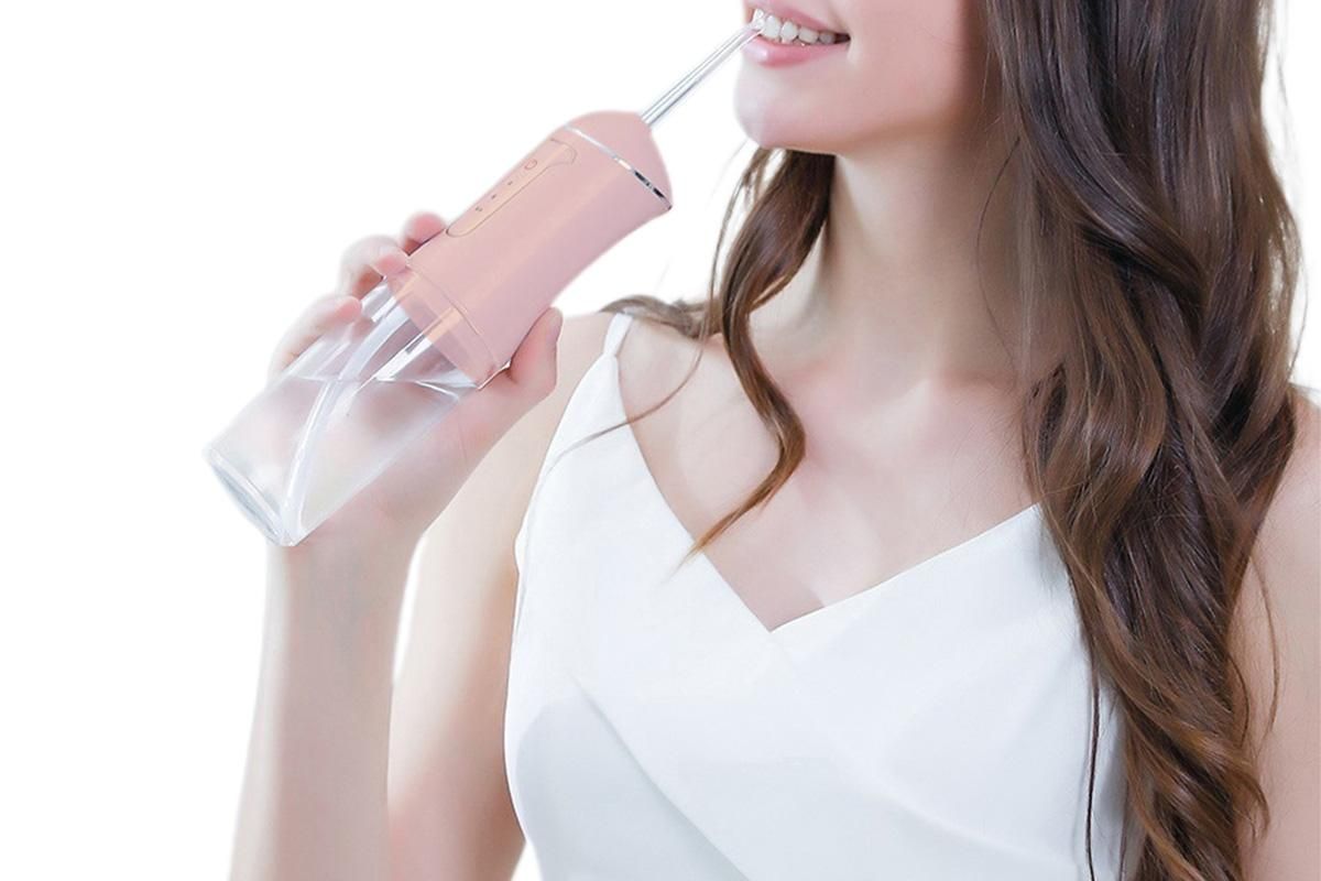 Cordless Portable Electric Water Flosser Teeth Cleaner Floss Irrigator With 4 Jet Tips - Pink V1263-JX-6528-1