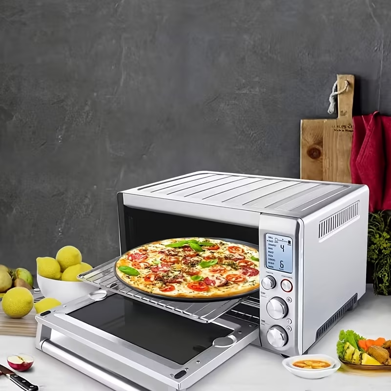 Two pizza baking pans, each 30.48 cm in diameter, feature ventilation holes for improved cooking efficiency V1345-SY54