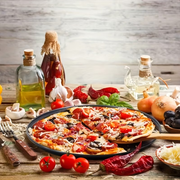 Two pizza baking pans, each 30.48 cm in diameter, feature ventilation holes for improved cooking efficiency V1345-SY54