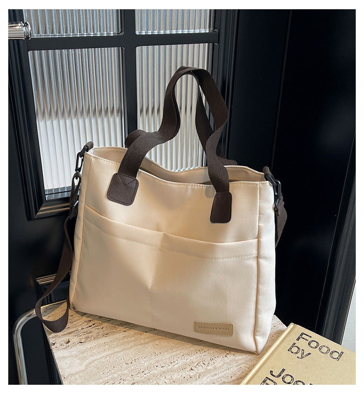 Stylish white canvas tote bag with detachable shoulder strap V888-ELOSUNG25001