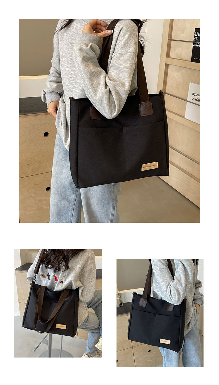 Stylish black canvas tote bag with detachable shoulder strap V888-ELOSUNG25003