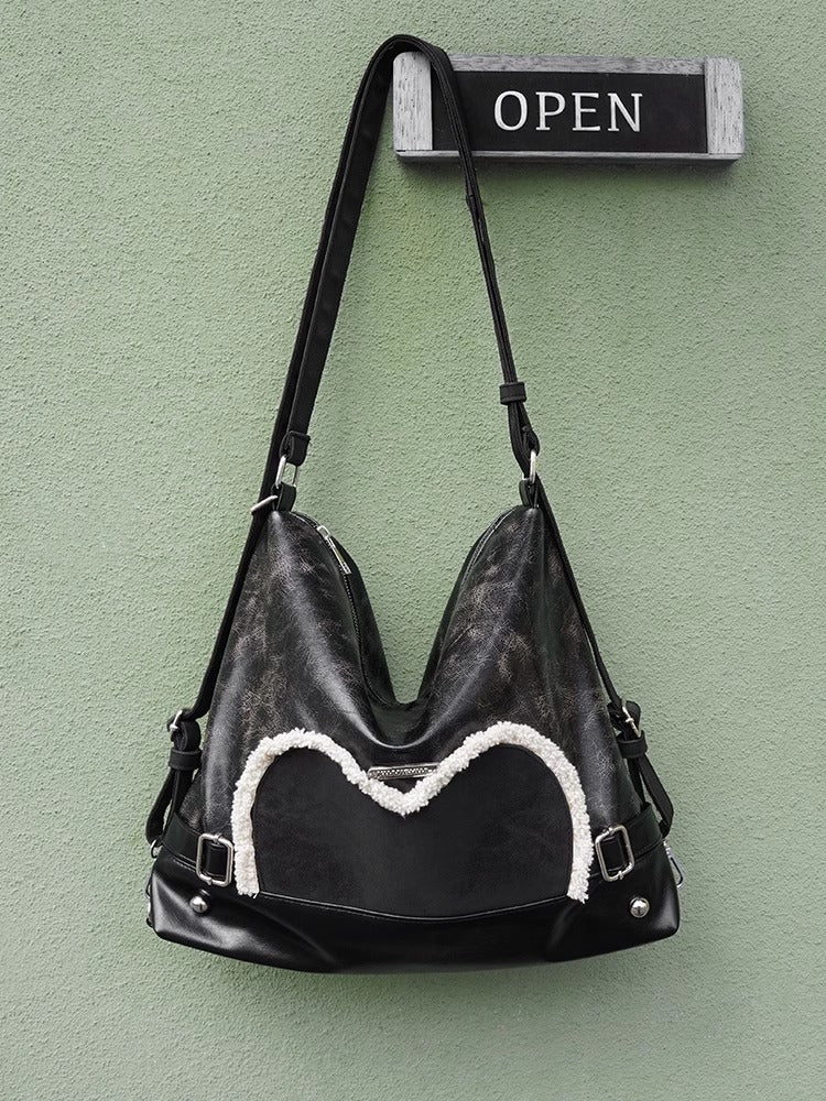 Stylish black tote backpack with heart embellishment - can be worn on one shoulder or as a backpack V888-ELOSUNG26250