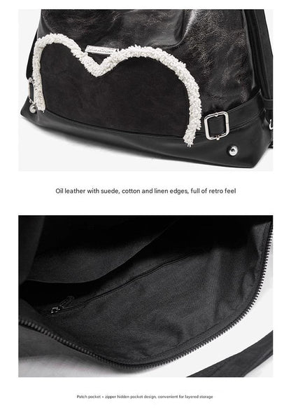Stylish black tote backpack with heart embellishment - can be worn on one shoulder or as a backpack V888-ELOSUNG26250