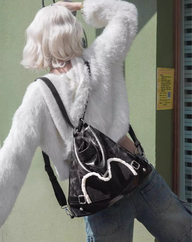 Stylish black tote backpack with heart embellishment - can be worn on one shoulder or as a backpack V888-ELOSUNG26250
