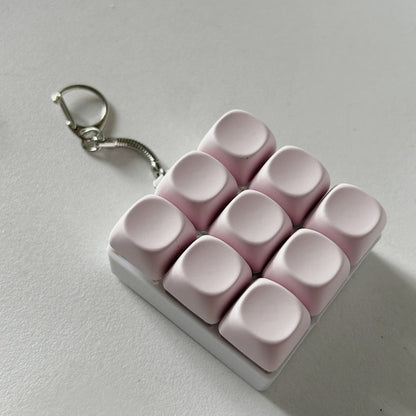 2-Pack Light Pink Mechanical 9-Keyboard Fingertip Toy Keychain - Key Pressure Relief, PVC Fingertip Toy V888-ELOSUNG39633