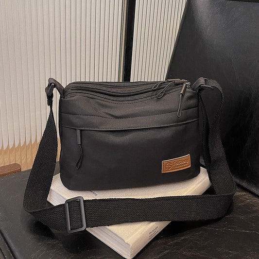 Casual Multi-Pocket Nylon Crossbody Bag Lightweight Shoulder Purse Waterproof Travel Messenger Bag Black V888-ELOSUNG44028